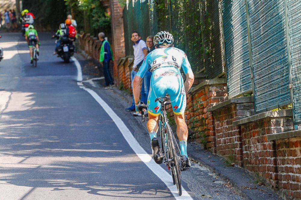 Miguel Angel Lopez chases down Mike Woods near the end of Milano-Torino