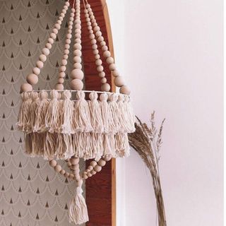 Beaded, tiered chandelier in boho style, with tassels