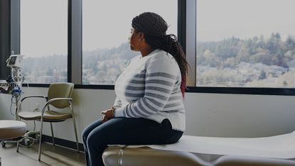 Woman on hospital bed