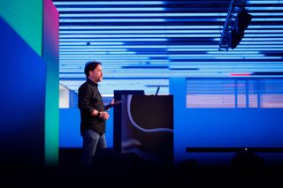 man presenting at a conference