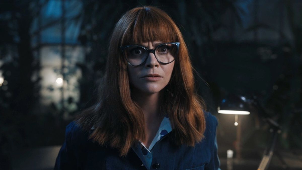 Christina Ricci with ginger hair and cat eye glasses as Ms. Thornhill in Wednesday