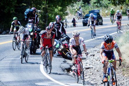 A TV moto lays on the ground after crashing during stage 6 at the Tour of Utah