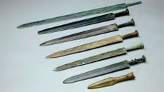 Bronze swords and a bronze spear tip.