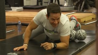 Mark Wahlberg foam rolling with James Corden during an episode of his late night show at 4 am.