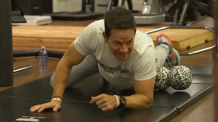 Mark Wahlberg foam rolling with James Corden during an episode of his late night show at 4 am.