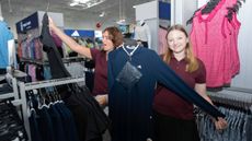 Women showing off clothes at a PGA TOUR Superstore