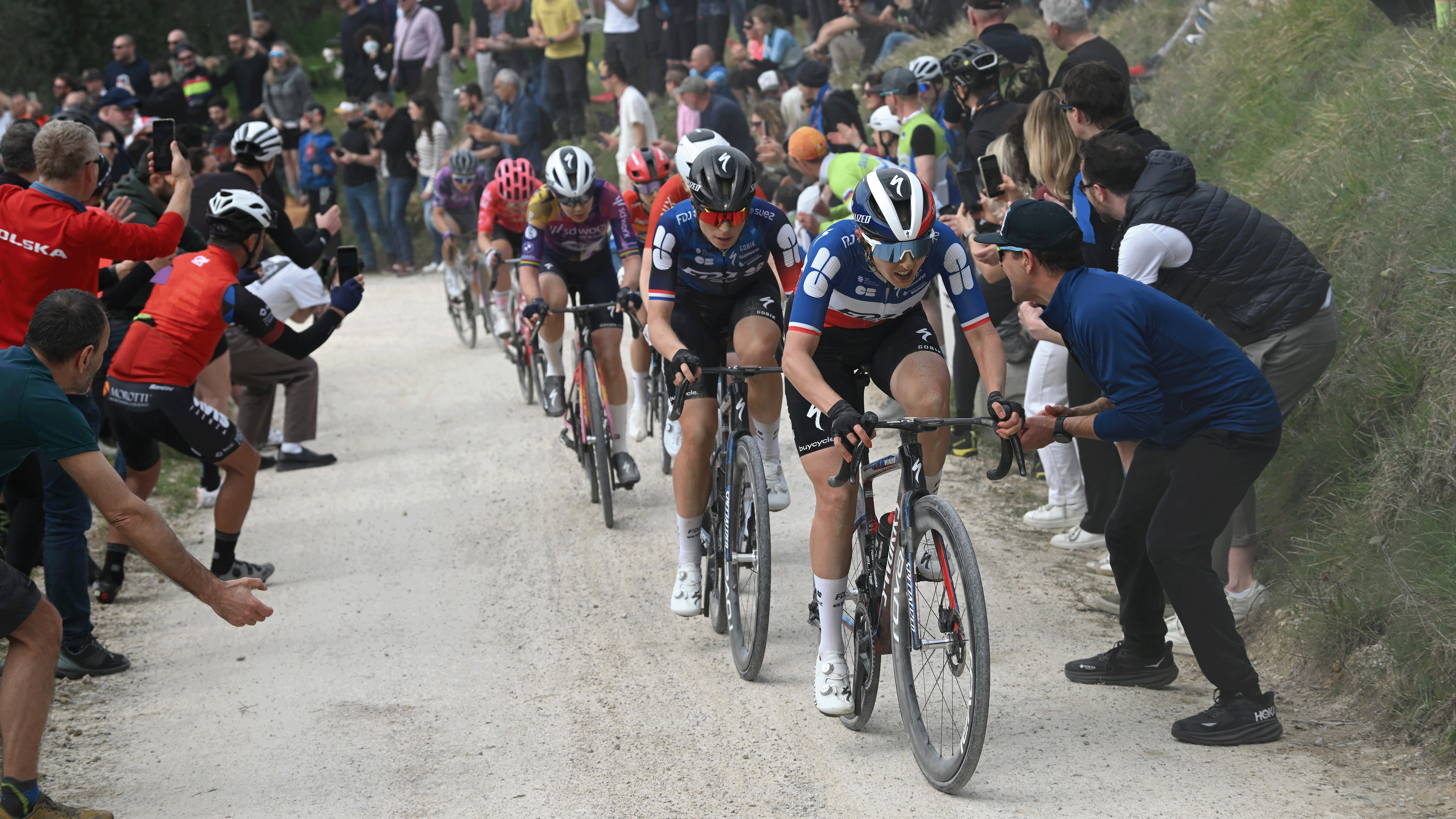 SIENA, ITALY - MARCH 08: (L-R) Demi Vollering of Netherlands and Juliette Labous of France and Team FDJ - SUEZ compete in the chase group while fans cheers during the 11st Strade Bianche 2025, Women's Elite a 136km one day race from Siena to Siena 320m / #UCIWWT / on March 08, 2025 in Siena, Italy. (Photo by Dario Belingheri/Getty Images)