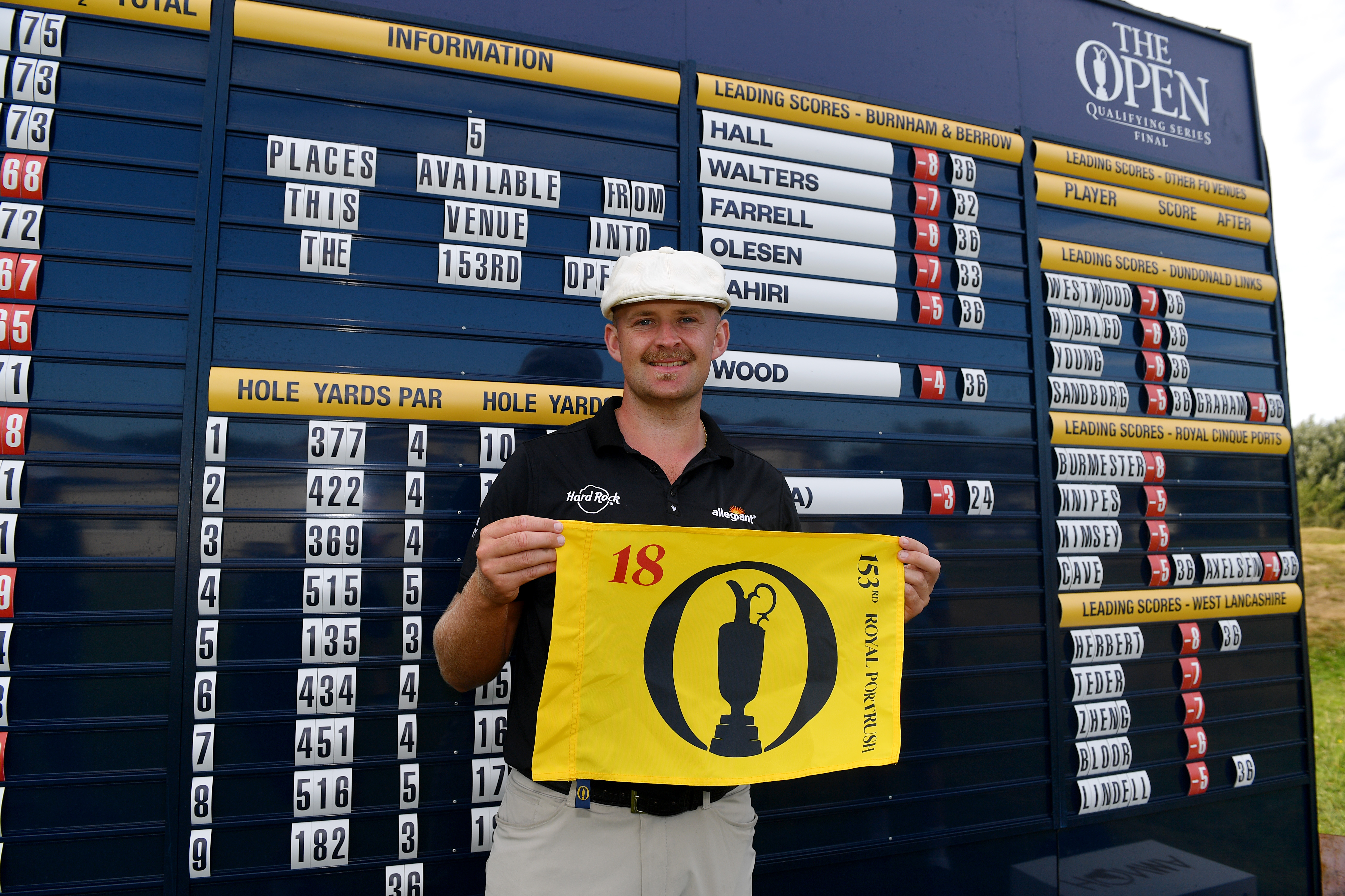 Harry Hall holds an Open Championship flag