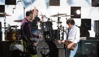 (from left) Krist Novoselic, Dave Grohl and Paul McCartney perform onstage at Madison Square Garden in New York City on December 12, 2012