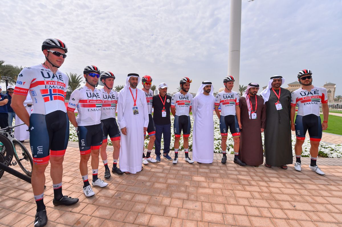 The UAE Team Emirates riders with local dignitaries