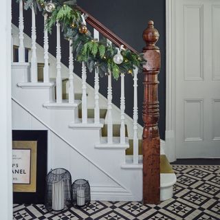 hallway with white staircase