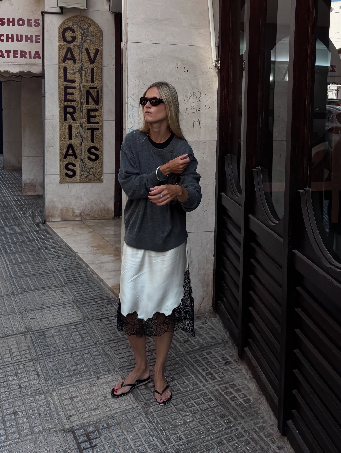 @lindatol_ wearing colored T-shirts under sweaters