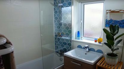 moroccan style bathroom with blue fish scale tiles and basin