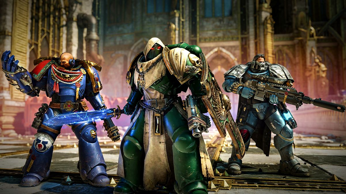 Warhammer 40,000: Space Marine 2 screenshot showcasing three fully-geared Space Marines standing side-by-side with weapons equipped