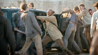Morgan fighting walkers in The Walking Dead.