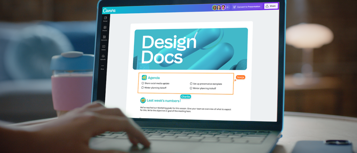 Canva Docs on a laptop screen, a hand hovering to the left