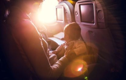 first class passenger gives seat to mum and baby