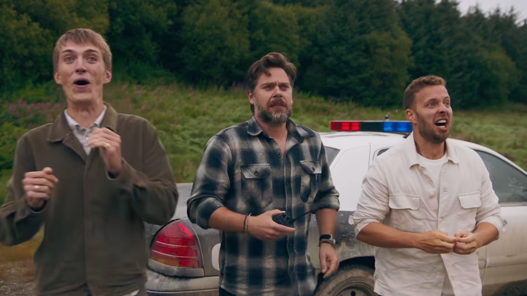 The three hosts of Grand Tour looking surprised. 
