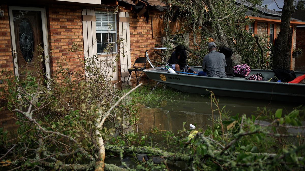 Residents are rescued from floodwater left behind by Hurricane Ida in LaPlace, Louisiana, U.S., on Monday, Aug. 30, 2021