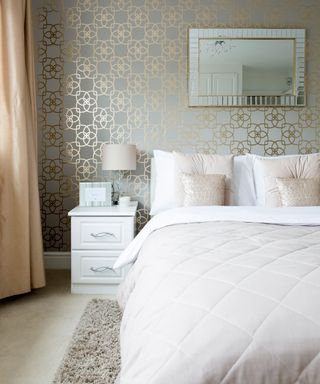 bedroom with pink bed and wallpaper