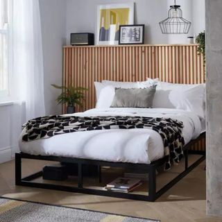 platform bed frame with white bedding on top