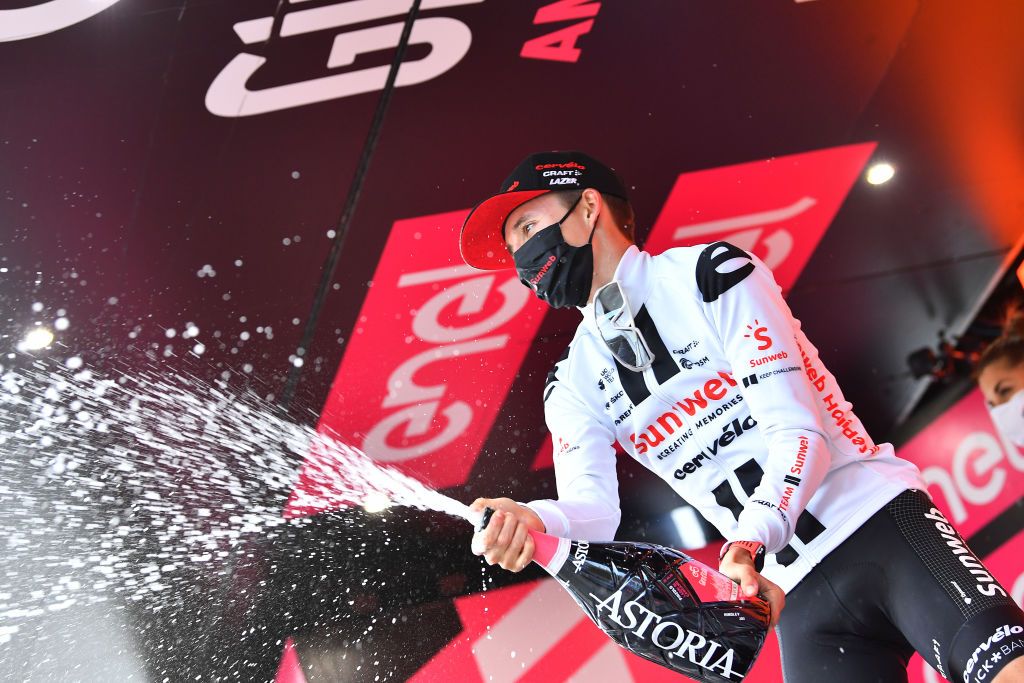 LAGHI DI CANCANO ITALY OCTOBER 22 Podium Jai Hindley of Australia and Team Sunweb Celebration Champagne during the 103rd Giro dItalia 2020 Stage 18 a 207km stage from Pinzolo to Laghi di Cancano Parco Nazionale dello Stelvio 1945m girodiitalia Giro on October 22 2020 in Laghi di Cancano Italy Photo by Stuart FranklinGetty Images