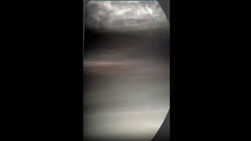 Still frame of mars clouds captured from NASA rover showing iridescent colors and white plumes.