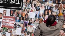 Photos of seniors who died during the Covid pandemic in nursing homes are displayed as family members attend a Covid memorial event on March 23, 2025 in Brooklyn, New York City. 