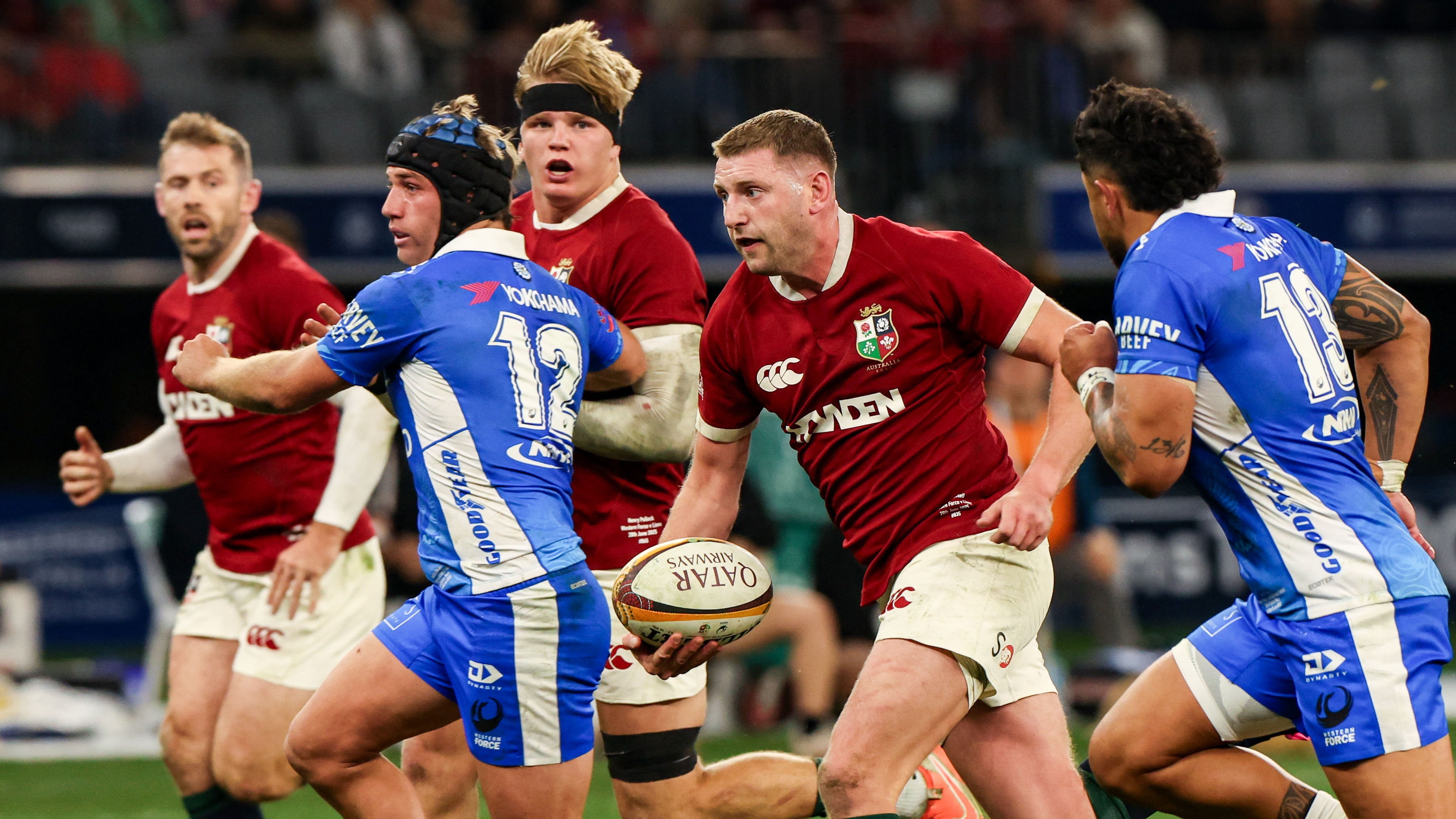 Finn Russell of British &amp; Irish Lions makes a break in the lead up to his side&#039;s third try, scored by Elliot Daly, left, during the tour match between Western Force and the British &amp; Irish Lions at Optus Stadium in Perth, Australia.