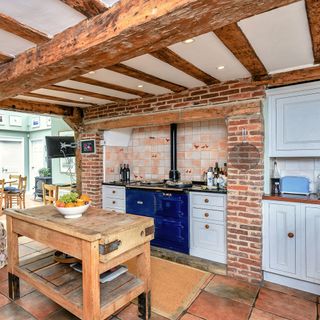 kitchen area with worktop and ceiling beams