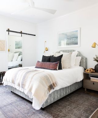 White bedroom with gray carpet and white walls
