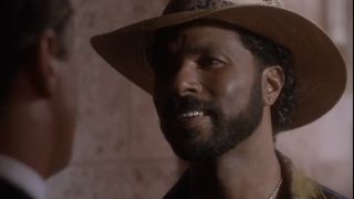 Philip Michael Thomas smiling and where a panama hat 