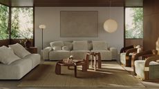 Image of a contemporary living room. There is a beige sofa at the back with an armless love seat to the left and two wooden and green accent chairs positioned to the right. In the middle of the seating are two wooden nesting coffee tables.