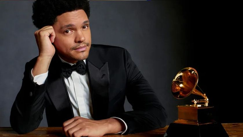 Host Trevor Noah poses with a golden gramophone ahead of the Grammy Awards 2026