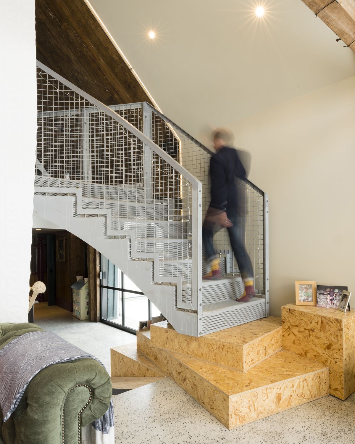 grey staircase up to landing with plywood