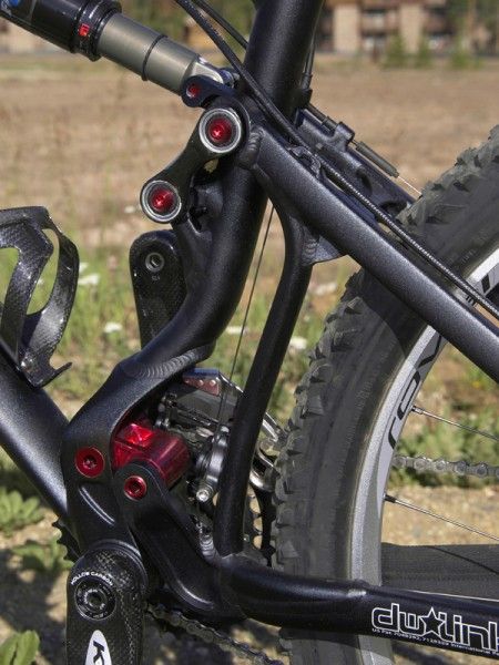 A pair of stout links carefully controls the movement of the rear end and keeps rear end flex in check