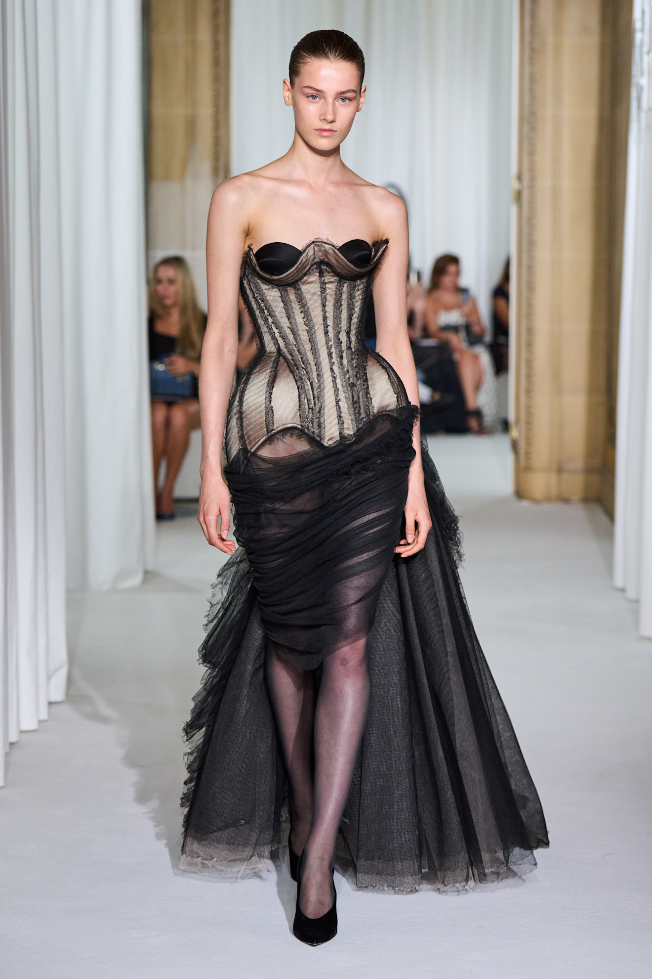 A model wore Millie Bobby Brown&#039;s corseted naked gown on the Ashi Studio Fall 2025 Couture runway