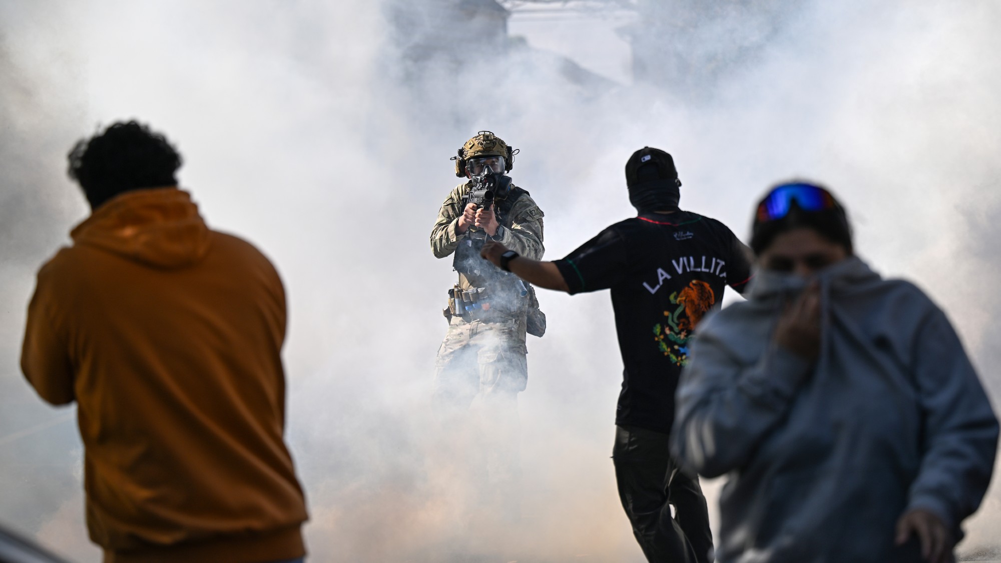Residents and protesters clash with federal agents in the East Side neighbourhood of Chicago