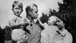 Queen Elizabeth II, and her husband Philip, Duke of Edinburgh, with their two children, Charles, Prince of Wales (L) and Princess Anne (R), circa 1951