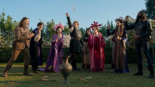 A group shot of The Decameron&#039;s main cast playing a game on a garden lawn