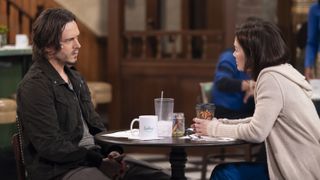 Jonathan Jackson and Rebecca Herbst as Lucky and Elizabeth talking at a table in General Hospital