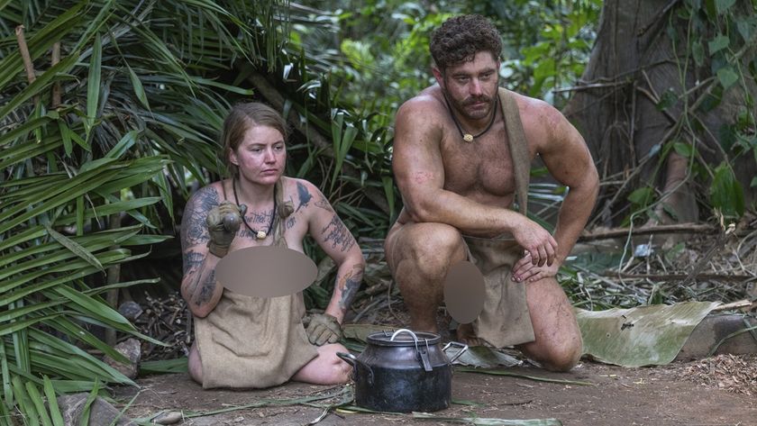 Tattooed double amputee Mandy and her partner Jonny sit naked and contemplating their next move as they try to survive 21 days in the jungles of Belize in Naked and Afraid Season 18.