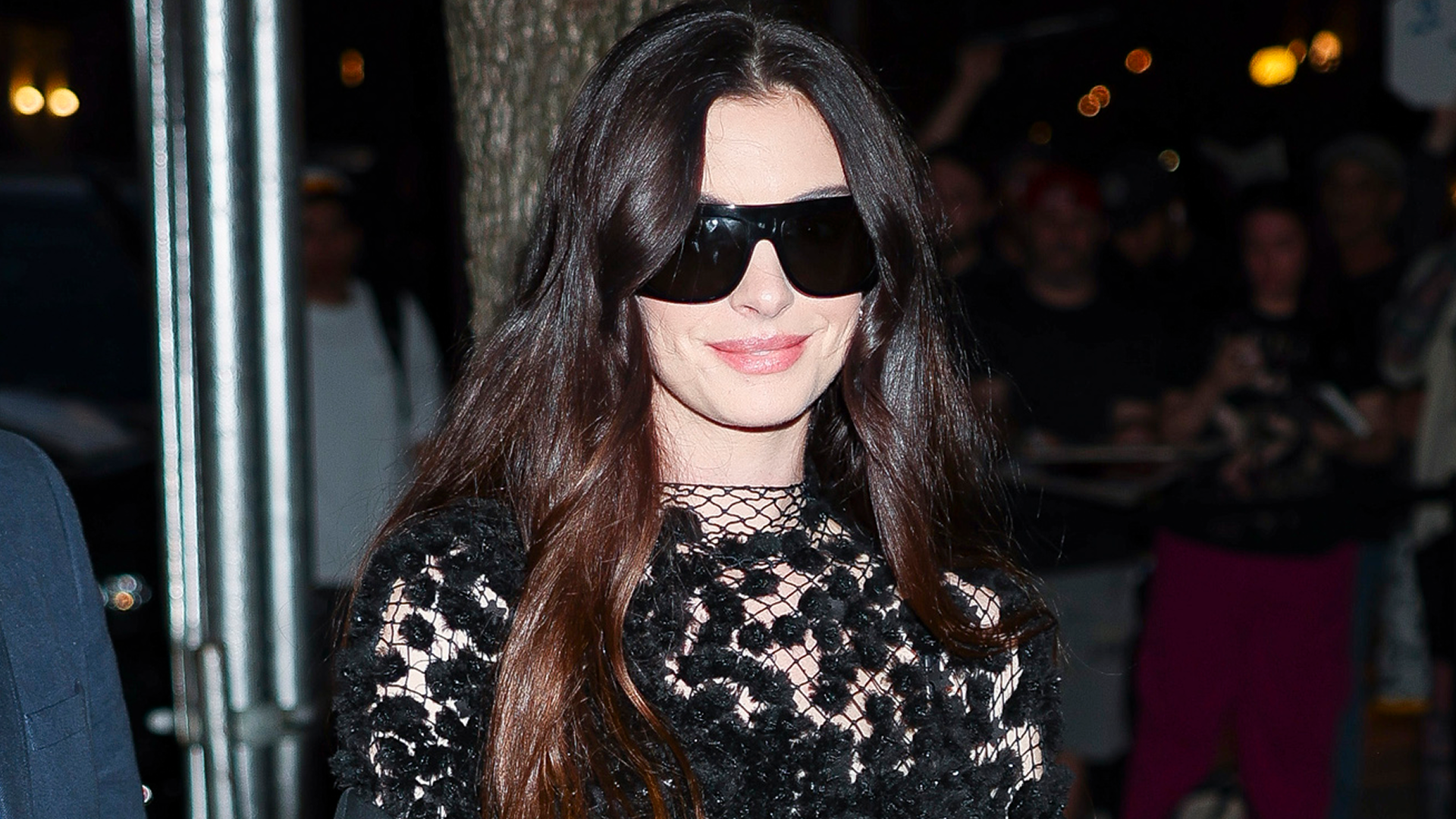 Anne Hathaway wore a naked Calvin Klein dress with a small Longchamp bag