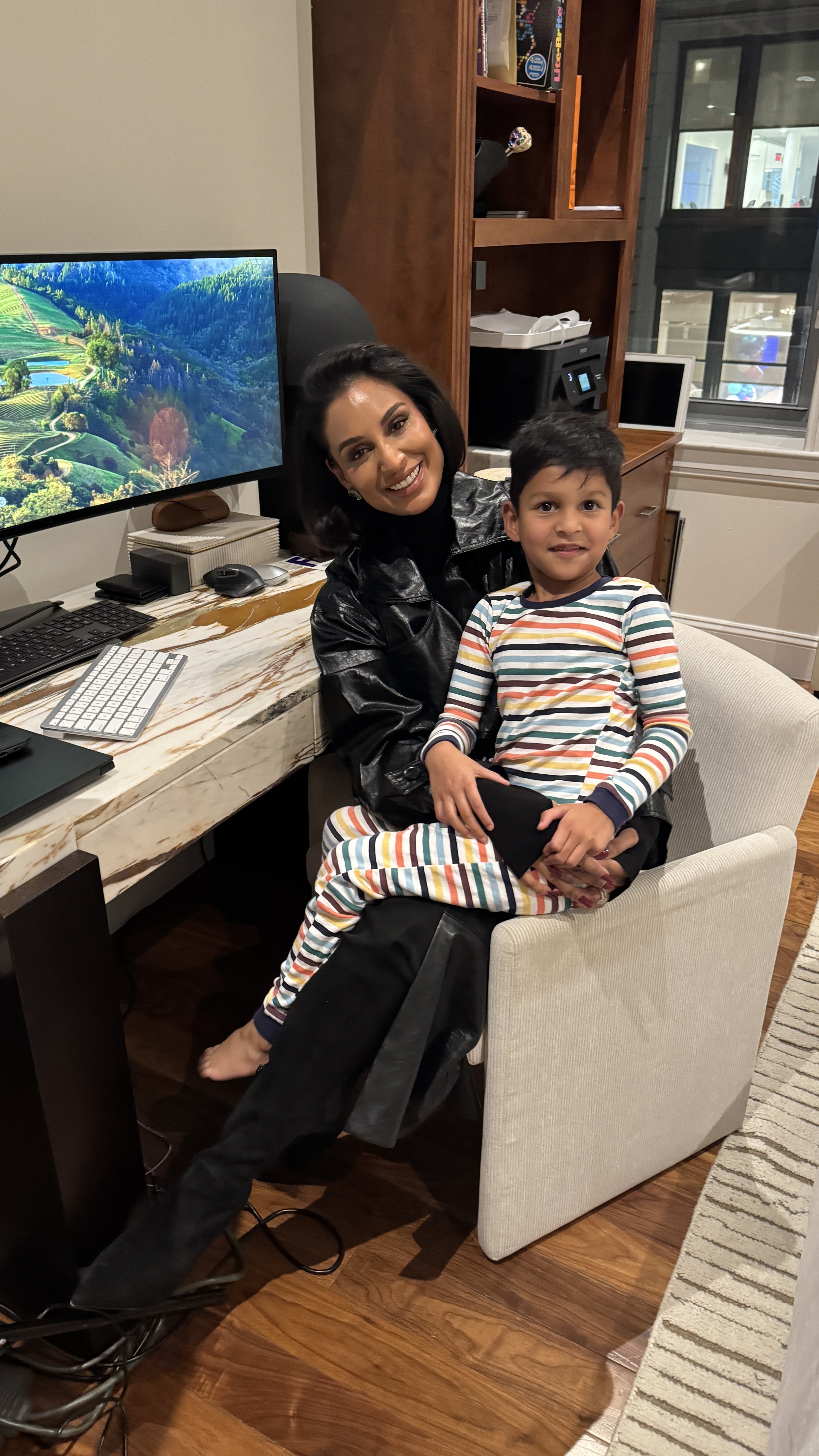 Jessel Taank sitting with her son.