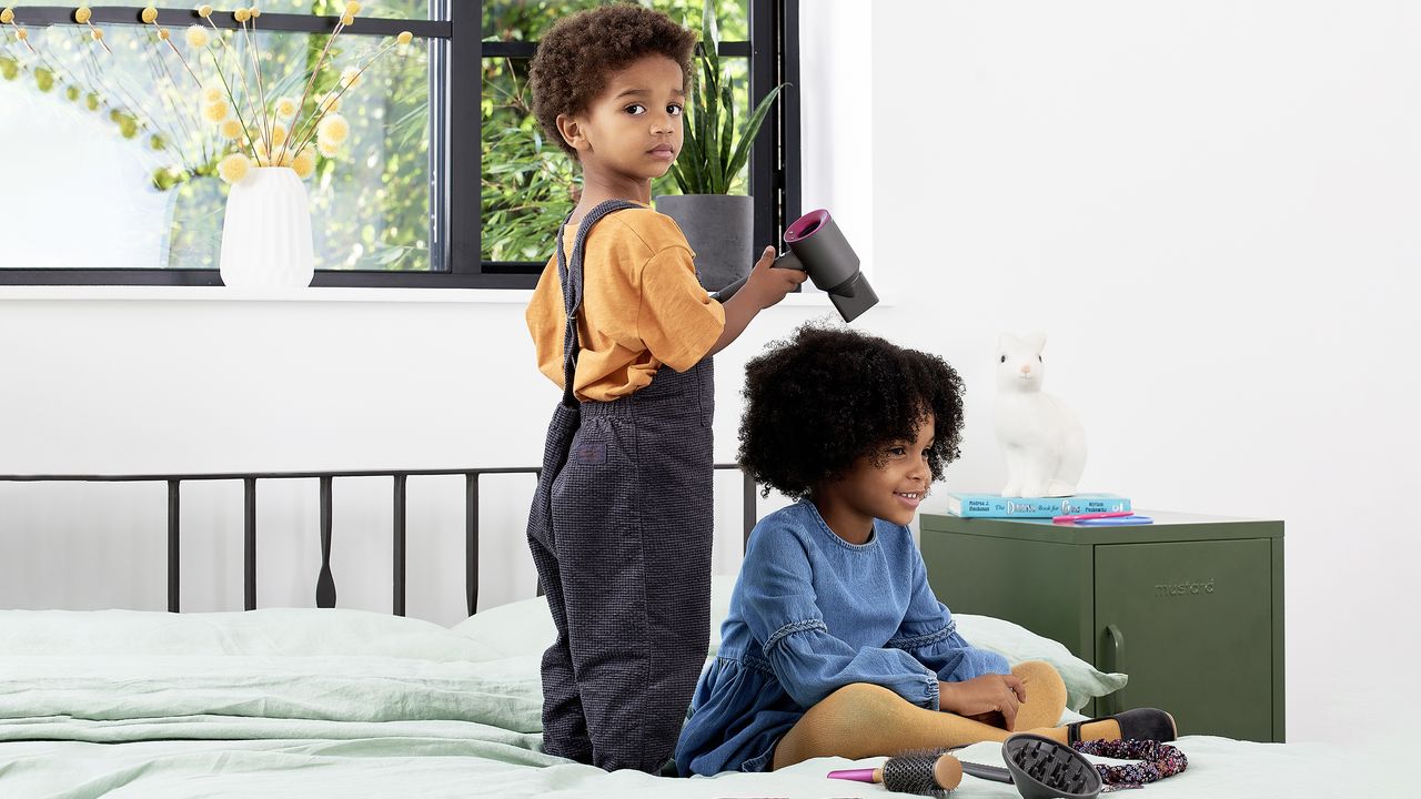 Children playing with Dyson haircare toys