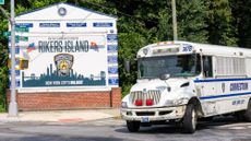 The entrance to Rikers Island is seen alongside a correctional bus in New York City.