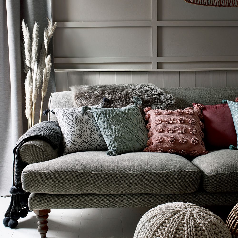 The £8 pompom Asda cushions stealing the spotlight this season Ideal
