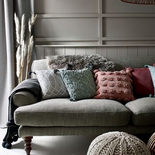 quilted throws with woollen blankets and sofa with cushions