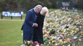 london, england april 15 prince charles, prince of wales and camilla, duchess of cornwall visit the gardens of marlborough house, london, to view the flowers and messages left by members of the public outside buckingham palace following the death of the duke of edinburgh, on april 15, 2021 in london, england photo by jeremy selwyn wpa poolgetty images