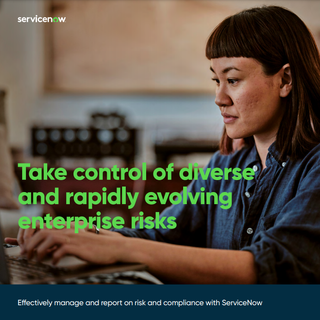 Whitepaper cover with image of female working at a computer with blurred image of tables and chairs in background